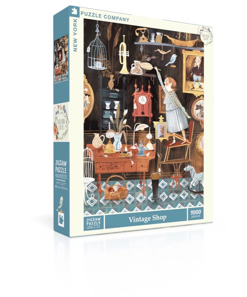 New York Puzzle Company 1000 piece Vintage Shop puzzle with artwork by Adelina Lirius.